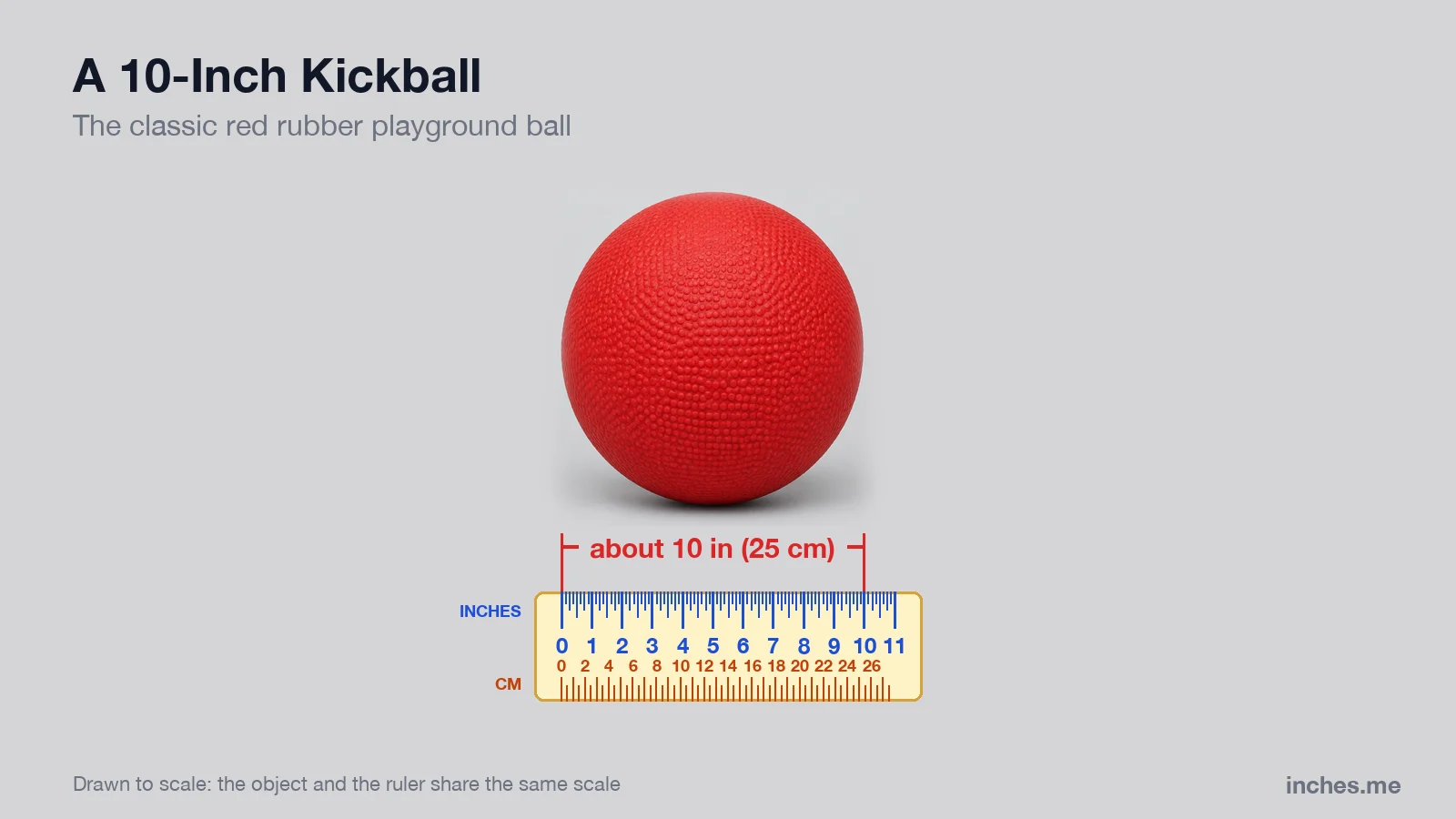 Red rubber playground kickball above a ruler, about 10 inches across