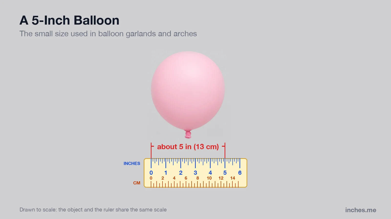 Small pink latex balloon above a ruler, about 5 inches across