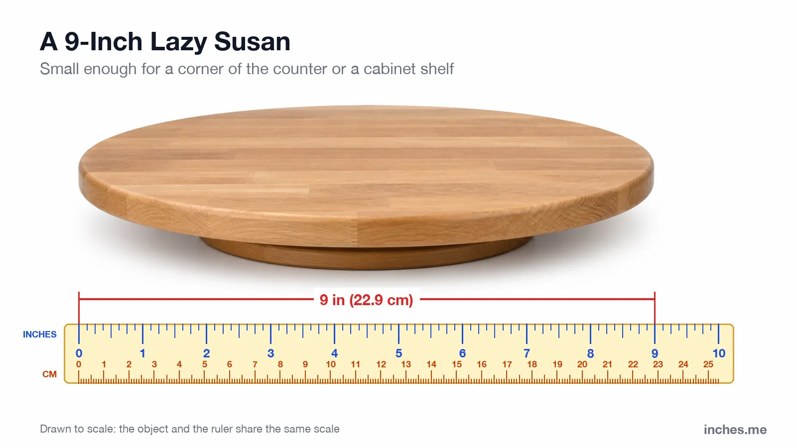 Round wooden lazy susan turntable above a ruler, 9 inches across